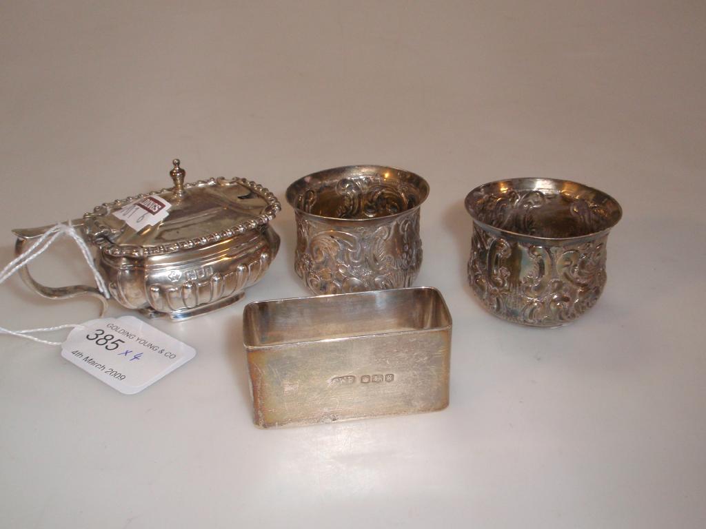 Appraisal: A silver napkin ring silver mustard pot and two silver