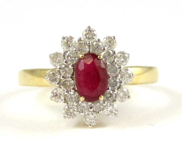 Appraisal: RUBY AND DIAMOND RING IN FOURTEEN KARAT SETTING having central