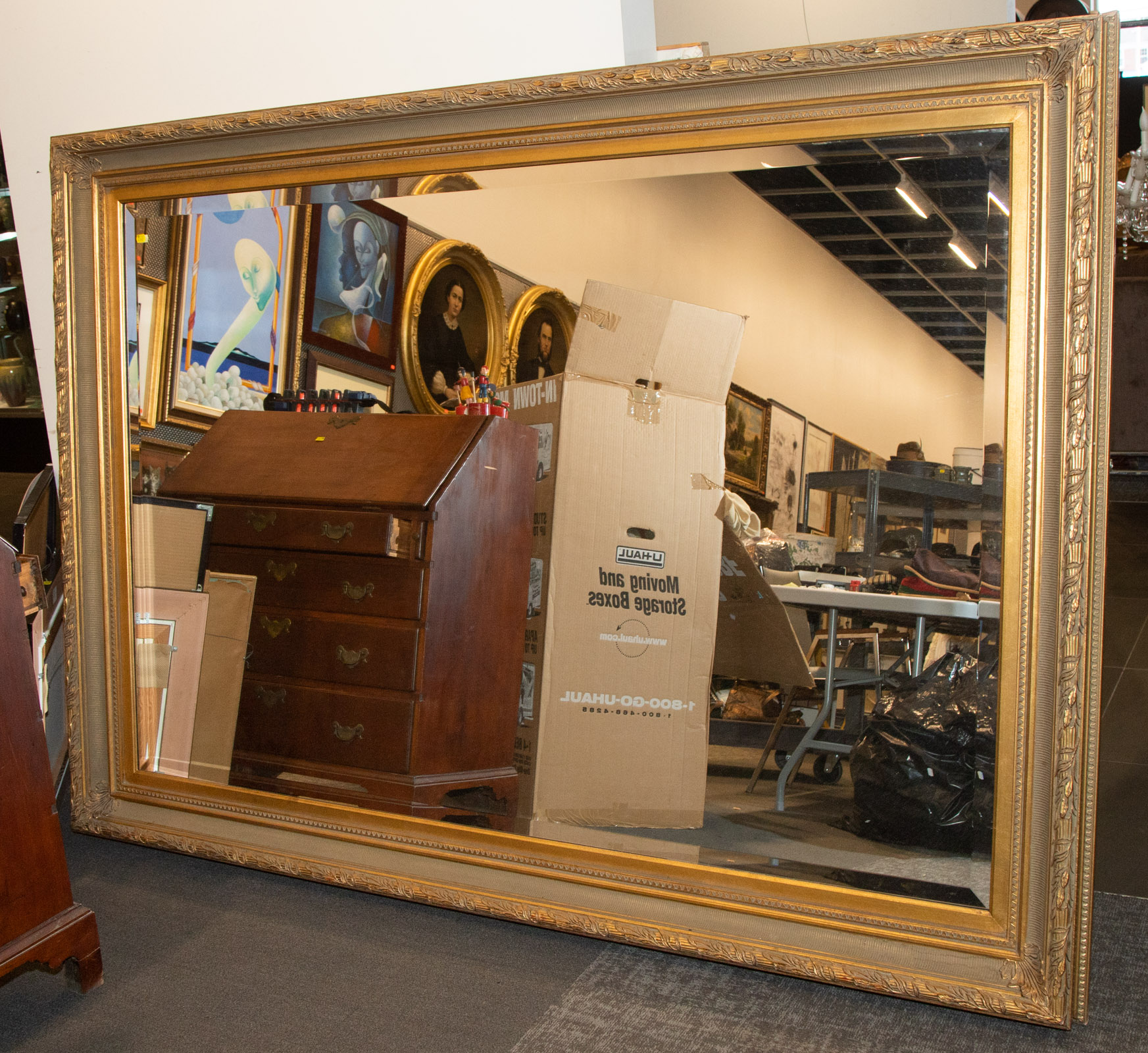 Appraisal: A LARGE GILT FRAMED MIRROR in H in L