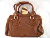 Appraisal: A Lady's soft leather handbag with heavy matching padlock by