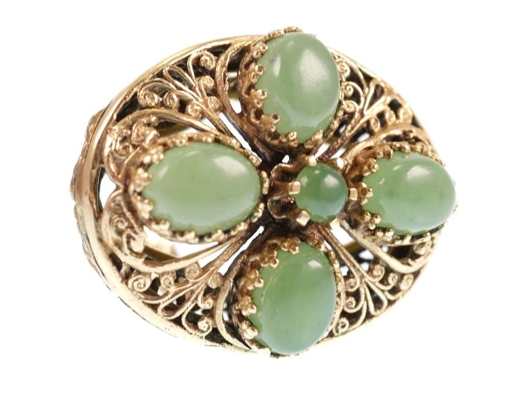 Appraisal: K yellow gold ring contains cabochon cut pieces of green