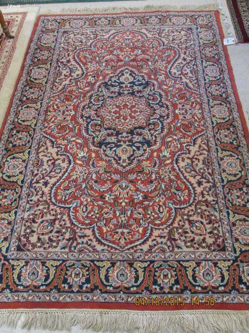 Appraisal: HAND KNOTTED ORIENTAL AREA RUG Indo-Persian floral and central floral