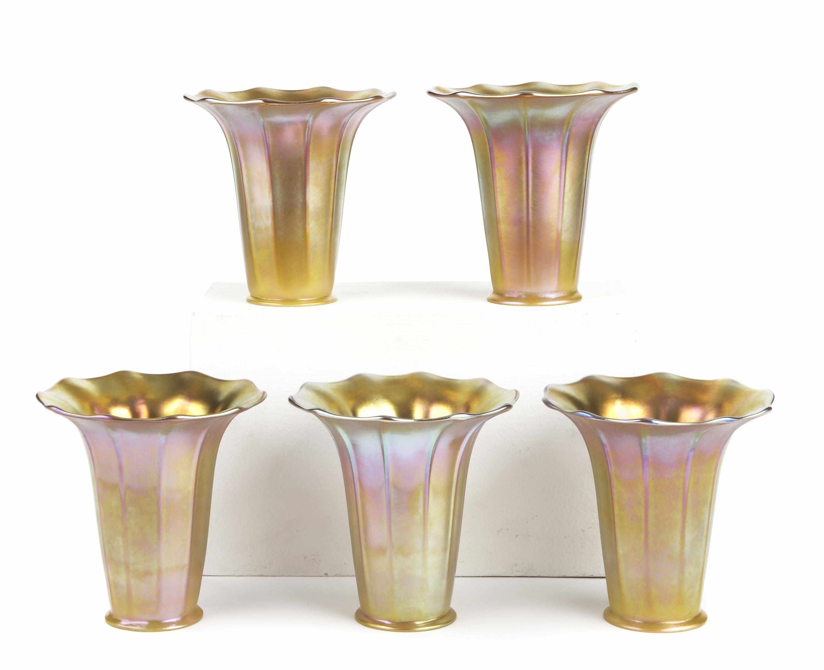 Appraisal: A set of five Quezal iridescent glass ribbed floriform shades