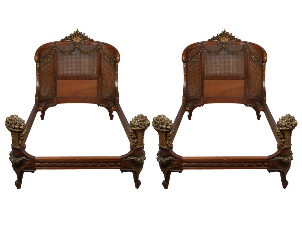 Appraisal: PAIR OF LOUIS XVI STYLE CANED FRUITWOOD BEDSeach with gilt