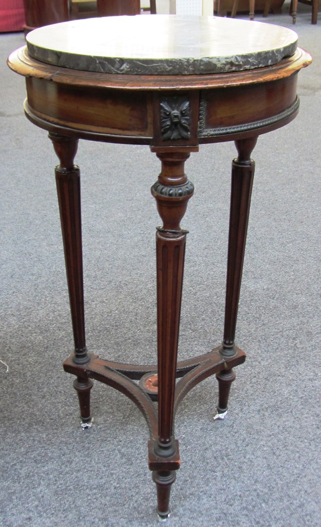 Appraisal: A French mahogany and gilt metal mounted and variegated marble