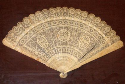 Appraisal: Carved ivory fan Mounted in a shadow box with John