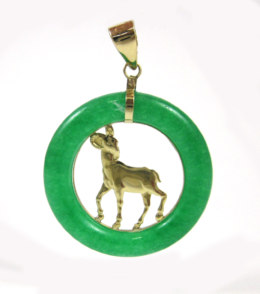 Appraisal: JADE AND FOURTEEN KARAT GOLD PENDANT having a yellow gold