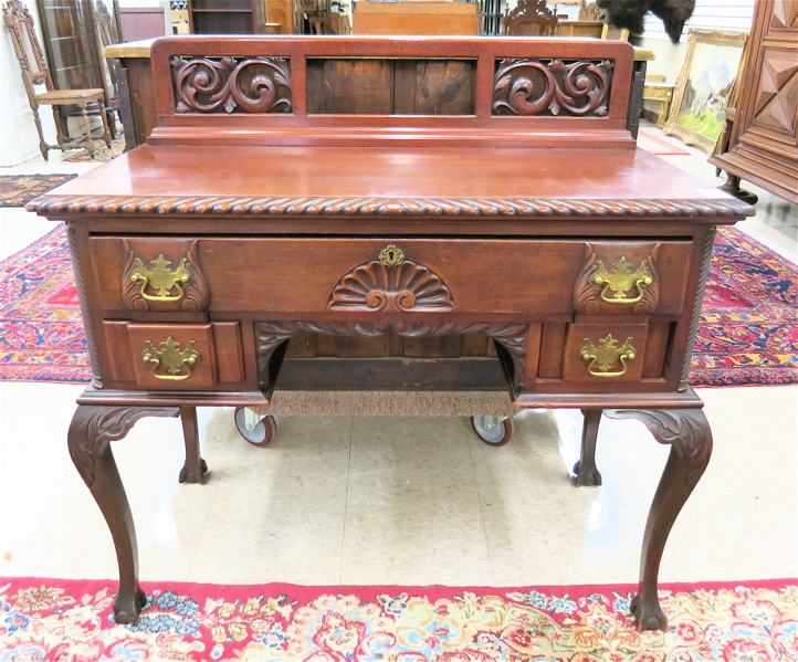 Appraisal: CHIPPENDALE REVIVAL MAHOGANY WRITING DESK American c having a carved