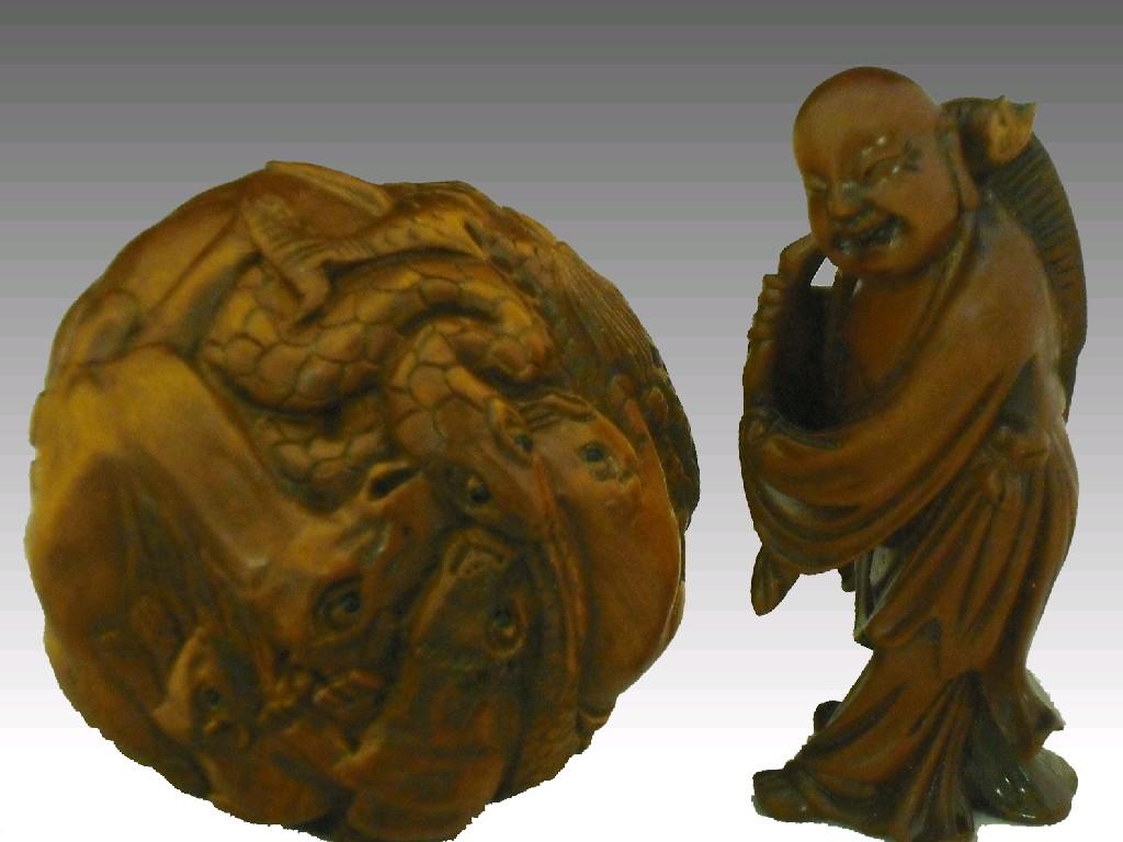 Appraisal: Spherical hardwood netsuke decorated with numerous animals signed diameter together