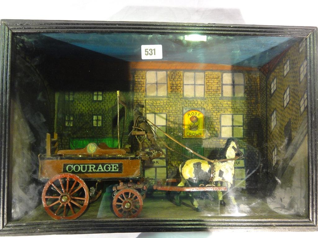 Appraisal: A glazed display cabinet with a Courage beer delivery horse