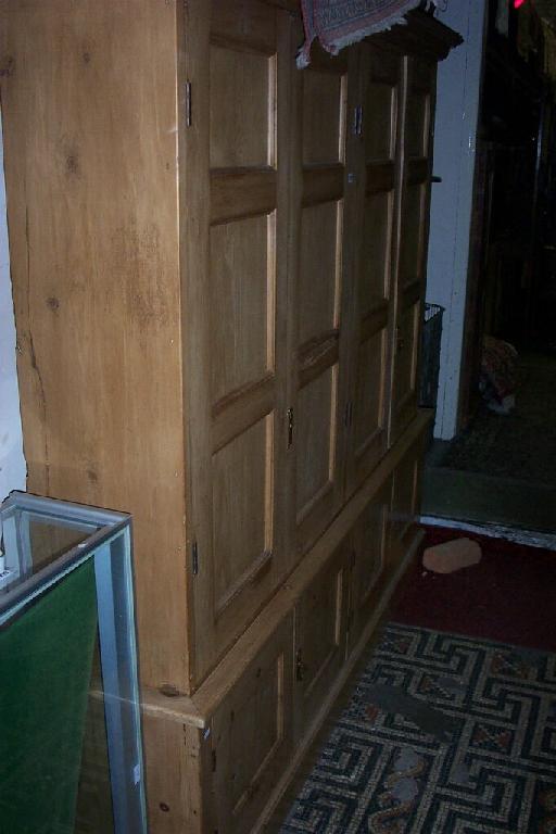 Appraisal: A stripped and waxed pine -sectional housekeepers side cupboard each