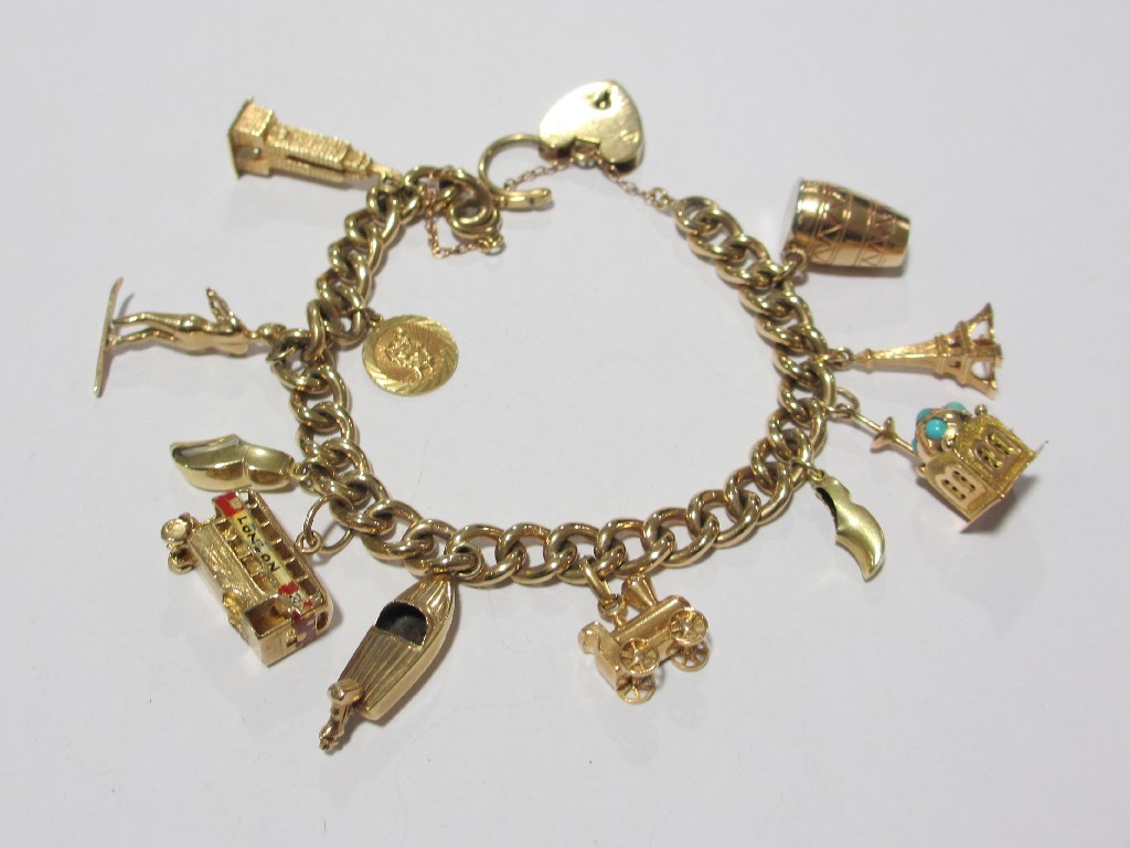 Appraisal: Nine carat gold charm bracelet with eleven various ct gold