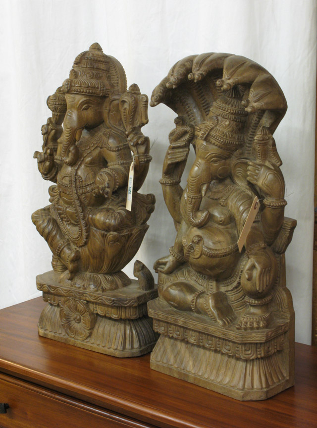 Appraisal: TWO FIGURAL WOOD CARVINGS two versions of Ganesha Heights and