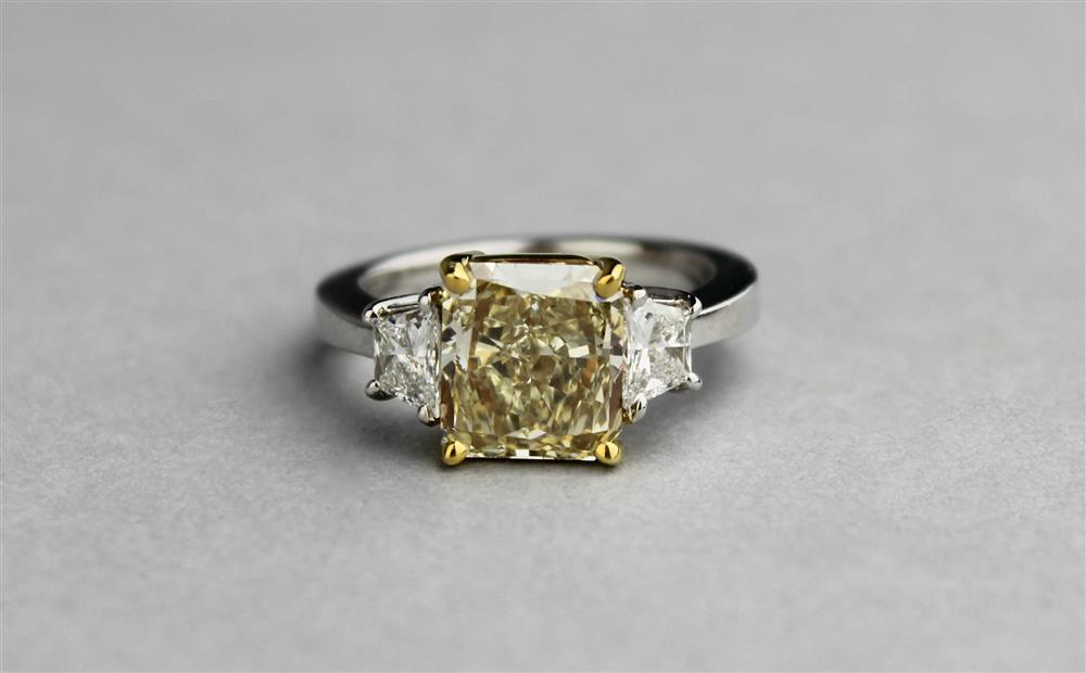 Appraisal: PLATINUM K YELLOW GOLD FANCY YELLOW DIAMOND AND DIAMOND RING