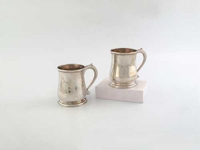 Appraisal: A pair of George II small mugs squat with s-scroll