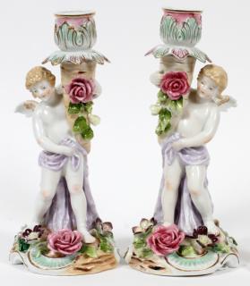 Appraisal: PORCELAIN CHERUB CANDLESTICKS C PAIR PORCELAIN CHERUB CANDLESTICKS C PAIR