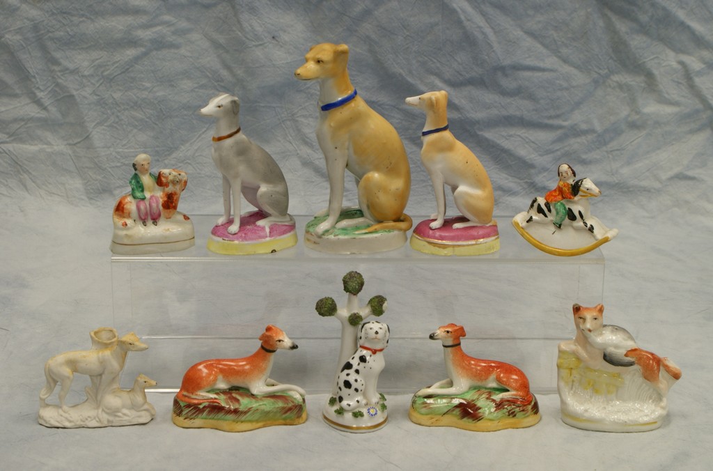 Appraisal: asstd porcelain and Staffordshire pottery dog fox horse figurines tallest