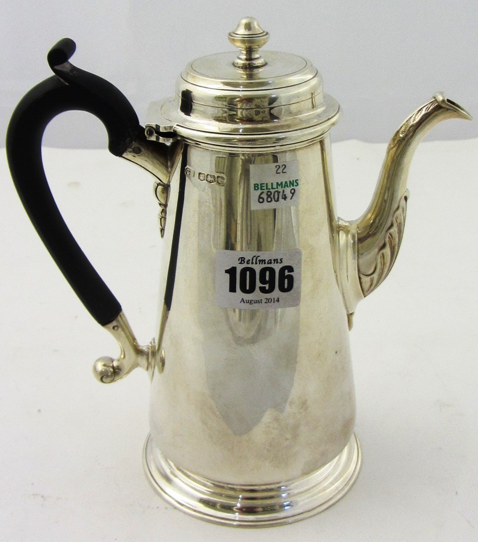 Appraisal: A silver coffee pot of tapering cylindrical form in the