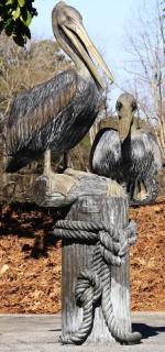 Appraisal: Bronze sculpture of two pelicans h Patinated bronze sculpture of