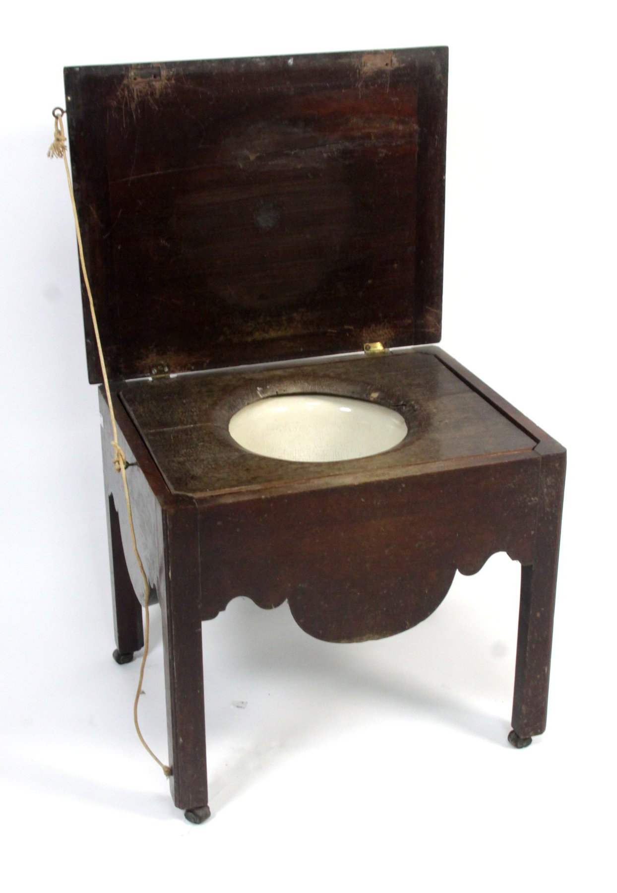 Appraisal: A George III mahogany commode the hinged lid enclosing a