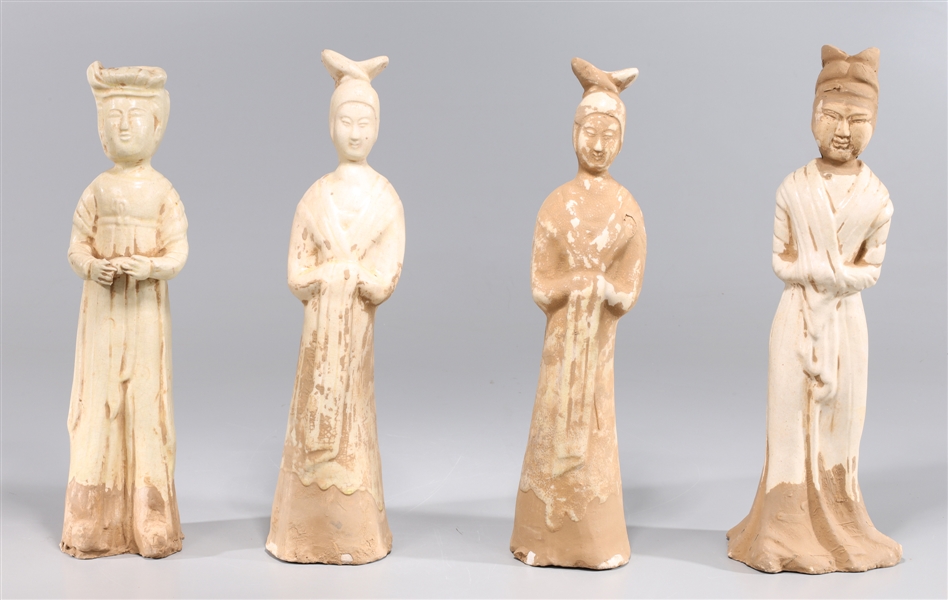 Appraisal: Group of four Chinese straw glazed standing female attendants each