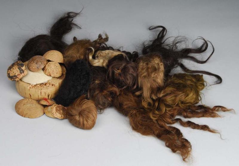 Appraisal: Lot of Pates and Wigs Description Five antique dark human