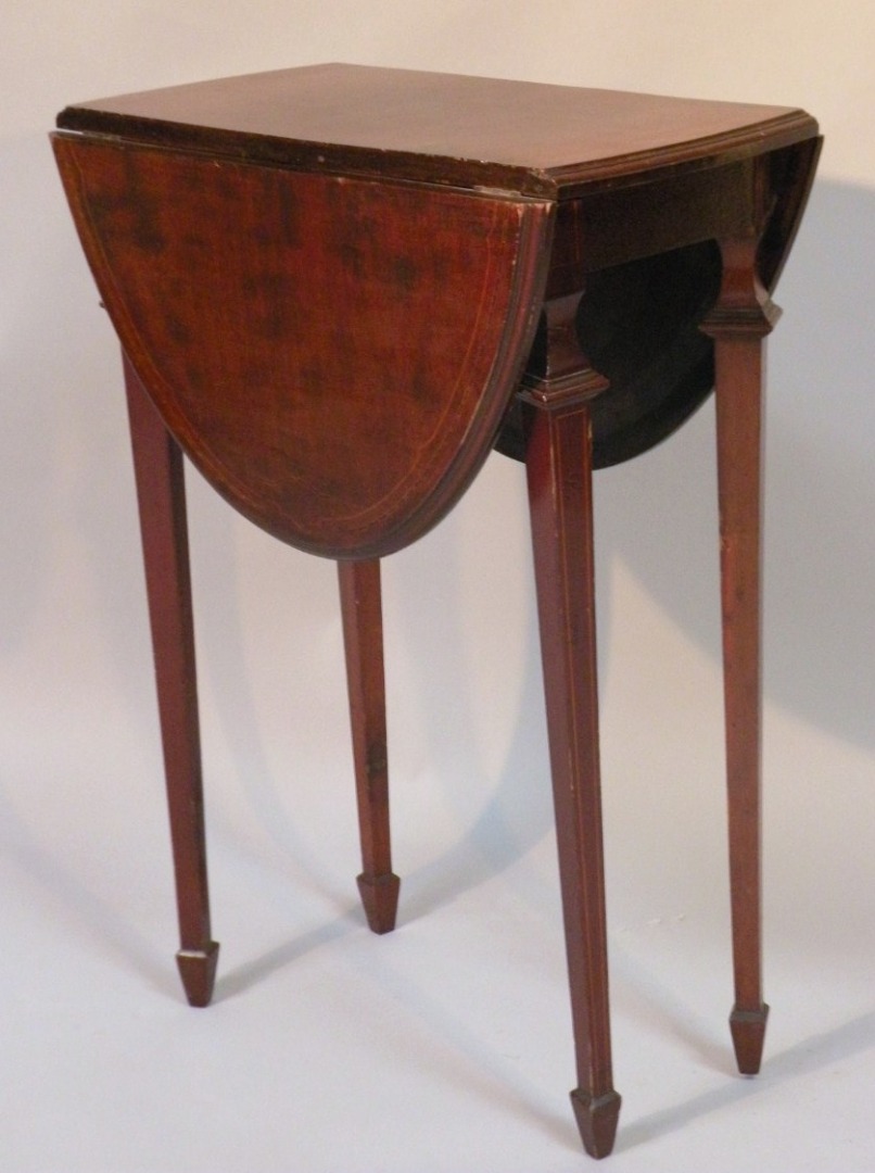 Appraisal: An early thC mahogany and boxwood strung dropleaf occasional table