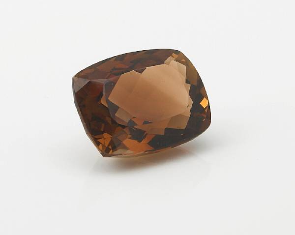 Appraisal: Golden Brown Topaz An unmounted cushion-shaped stone having a checkerboard-faceted