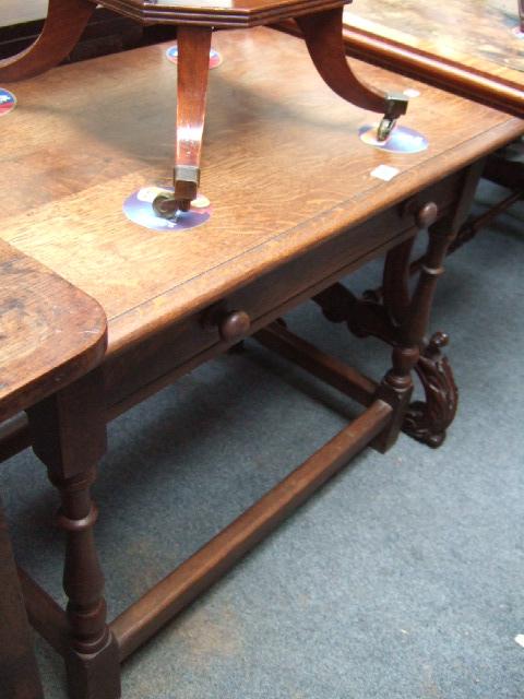 Appraisal: An th century style oak side table the single frieze