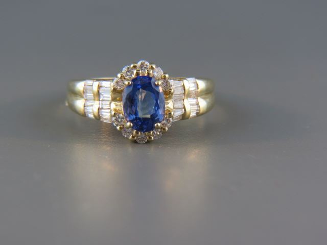 Appraisal: Tanzanite and Diamond Ring rich carat oval gem with round