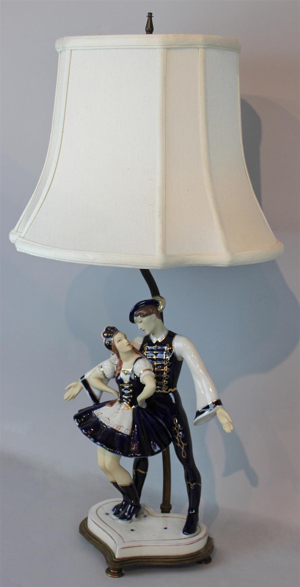 Appraisal: ROYAL DUX STYLE LAMP WITH CERAMIC BLUE AND WHITE DANCERS