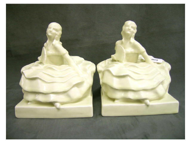 Appraisal: Pair of signed Rookwood figural bookends depicting ladies in dresses