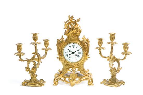 Appraisal: THREE PIECE CLOCK GARNITURE SET France early th century brass