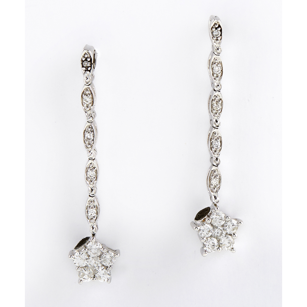 Appraisal: A pair of diamond set cluster pendant earrings each claw