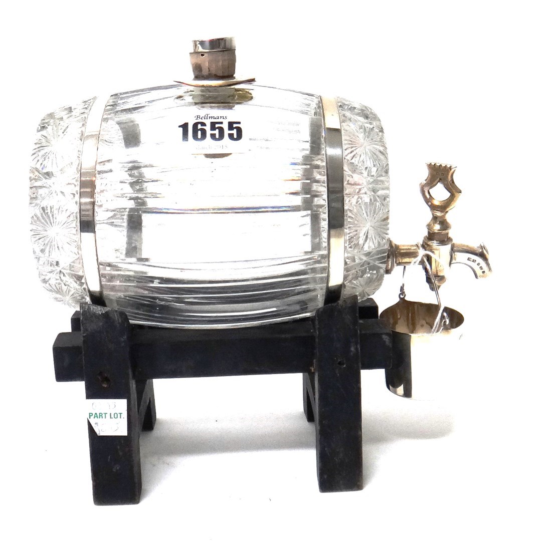 Appraisal: A silver mounted faceted glass spirit barrel with a silver