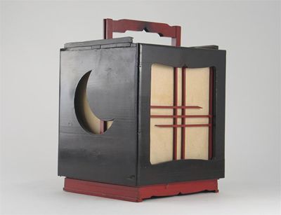 Appraisal: A Japanese laquered wood lantern the cube-shaped body rising to