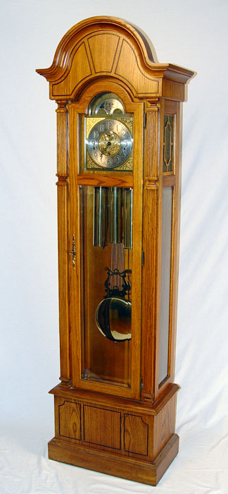 Appraisal: WURLITZER GRANDFATHER CLOCK Wood case with beveled glass door Moonphase