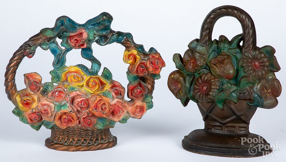 Appraisal: Two cast iron flower basket doorstops Two cast iron flower