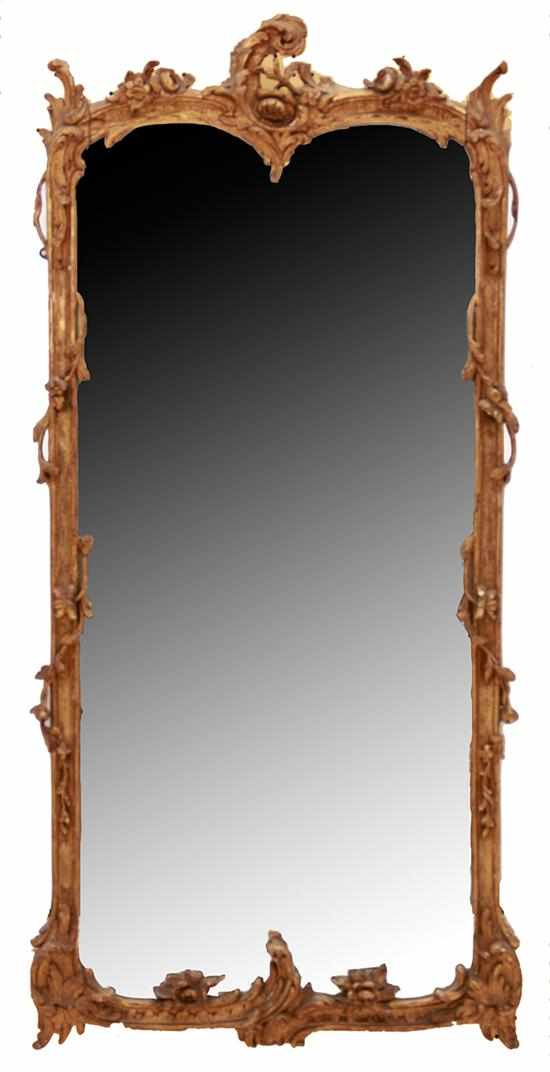 Appraisal: Rococo style giltwood mirror mid th century arched pediment with