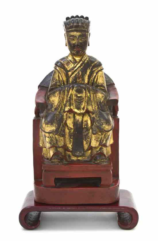 Appraisal: A Gilt and Lacquered Wood Figure of an Official depicted