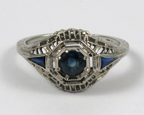 Appraisal: SAPPHIRE AND EIGHTEEN KARAT WHITE GOLD RING centering a round-cut