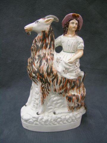 Appraisal: Staffordshire figure of a girl on a goat nicely modeled