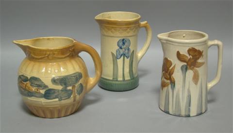 Appraisal: GROUP OF THREE BROWN AND CREAM GROUND PITCHERS Early th