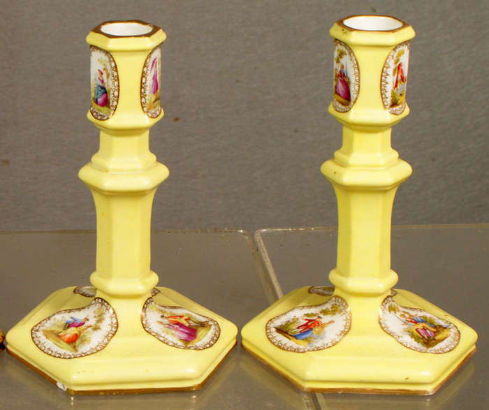 Appraisal: Pair of Continental porcelain candlesticks with pastoral figures with yellow