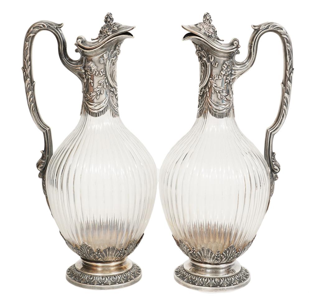 Appraisal: PAIR SILVER CRYSTAL HALLMARKED DECANTERSPair of silver mounted crystal decanters