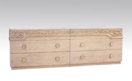 Appraisal: JAMES MONT Pair of painted oak three-drawer dressers carved with