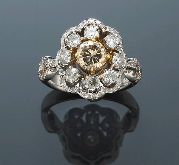 Appraisal: A colored diamond and diamond floral ring estimated total diamond