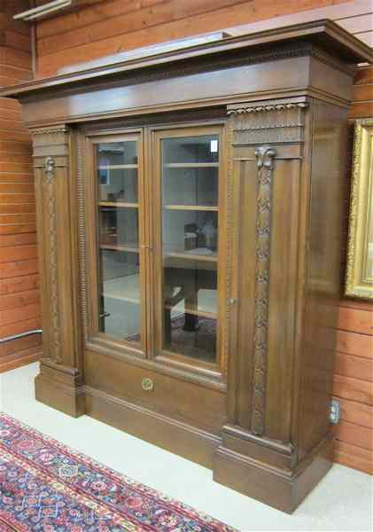 Appraisal: FOUR-DOOR CABINET BOOKCASE German early th century centering two glass