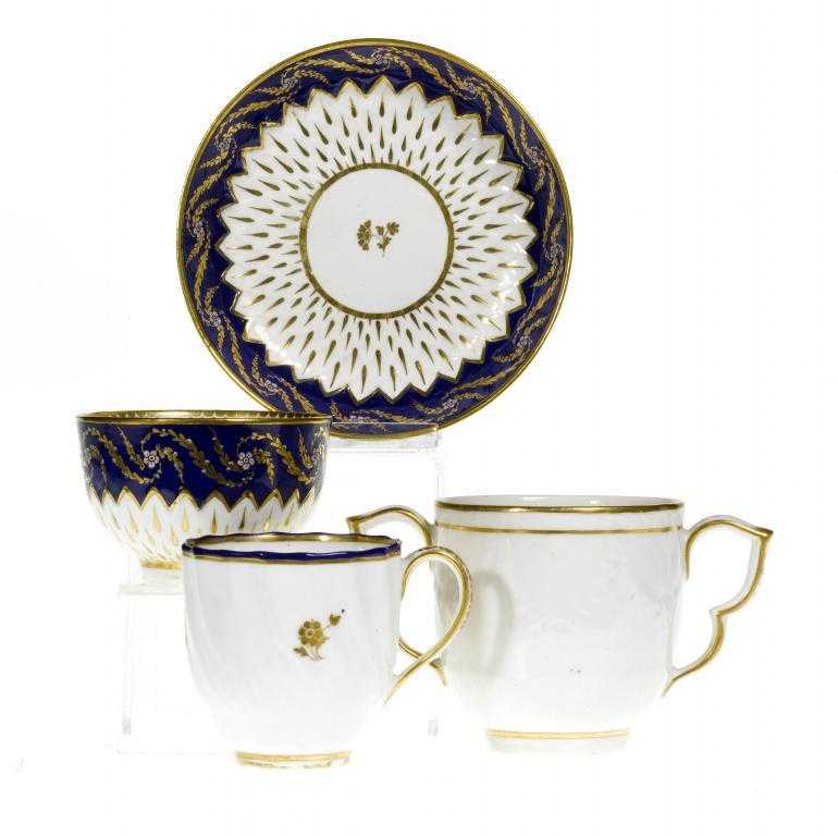 Appraisal: A DERBY MOULDED TEA BOWL AND SAUCER pattern gilt with