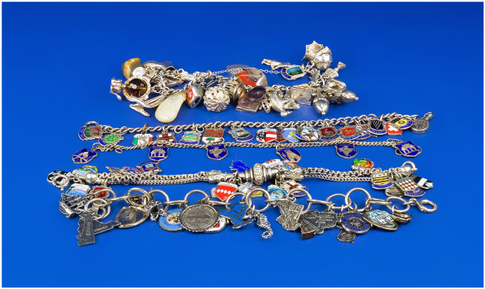 Appraisal: Collection Of Five Mostly Silver Charm Bracelets Loaded With Approx